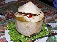 Seafood curry in a young coconut