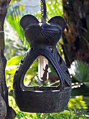 Gecko waiting for mosquitos in an outdoor light fixture