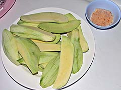 Sliced green mango with spicy salt